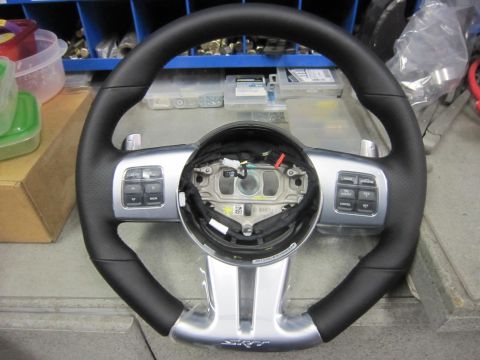 2008 Jeep Wrangler - A close-up view of a steering wheel an SRT logo and paddle shifters, likely a replacement part.