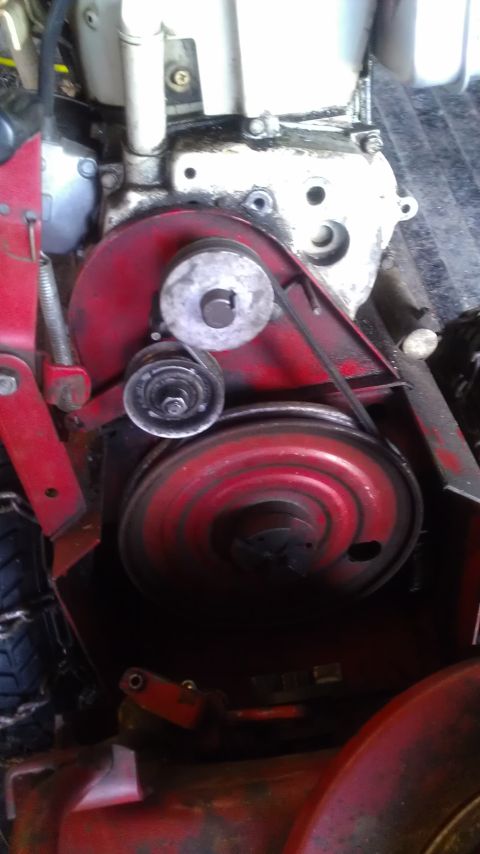1991 Toyota Tacoma - Close-up view of an engine's belt and pulley system, showing signs of oil leakage.