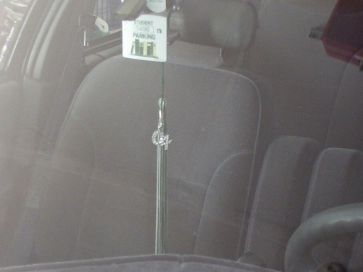 My senior tassle and parking permit up-close.