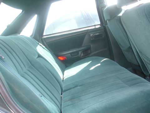 1993 Ford Taurus - The rear velour seats of a 1993 Ford Taurus show a typical interior from the era.