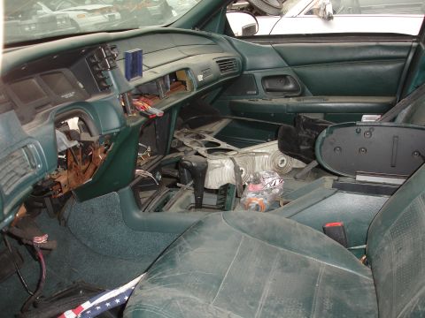 1993 Ford Taurus - Interior view of a 1993 Ford Taurus with the dashboard and center console disassembled.
