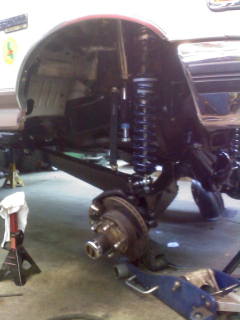 1996 Ford Bronco - Close-up view of a vehicle's custom suspension system, upgraded shocks and control arms.
