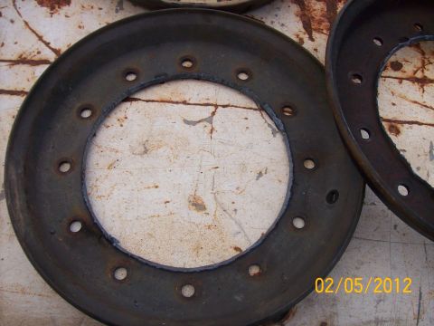 1982 Ford F-100 - Close-up of a brake drum, likely from an older vehicle, showing wear and bolt holes.