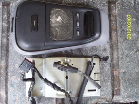 1993 Ford Bronco - Overhead console and wiring harness components are shown, detached from a vehicle.
