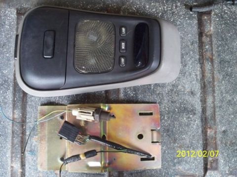 1993 Ford Bronco - Overhead console light assembly and associated wiring removed from a vehicle.