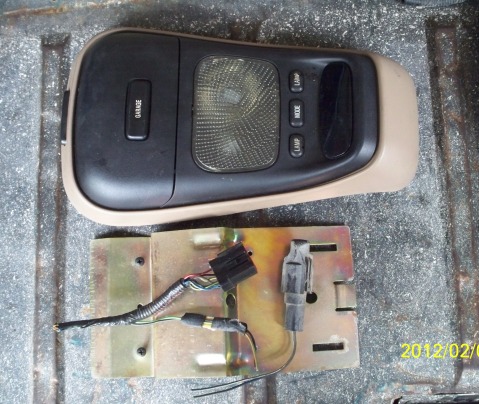 1993 Ford Bronco - Overhead console part with wiring harness and mounting bracket shown.