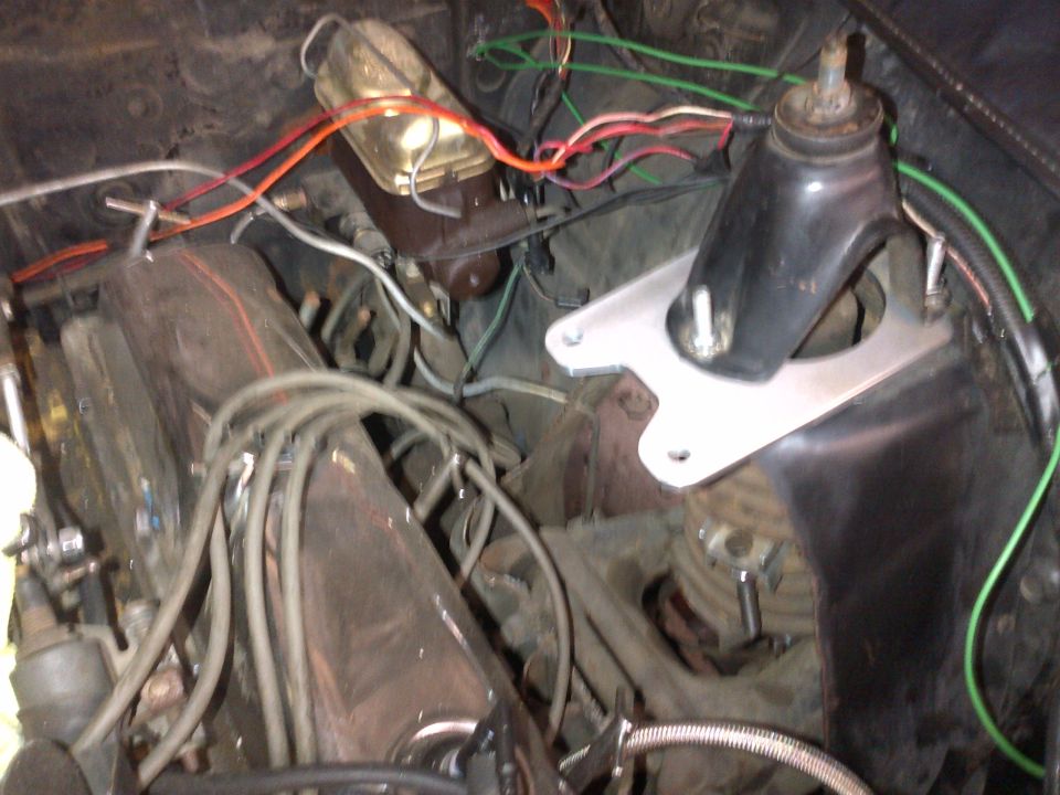 close-up of engine bay wiring and brake master cylinder
