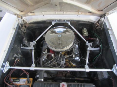1964 Ford Ranchero - The engine bay features a chrome air cleaner and aftermarket strut braces for chassis reinforcement.