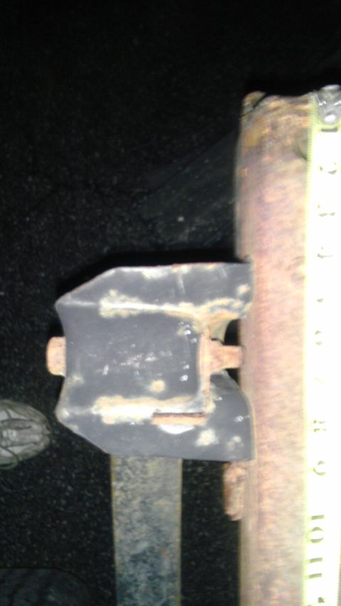 1987 Ford Ranger - A close-up view of a vehicle's suspension component, showing rust and bolts.