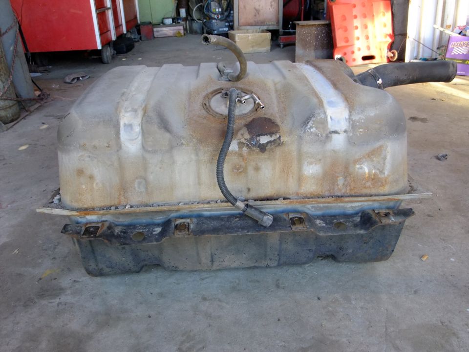 Fuel tank with hoses and filler neck