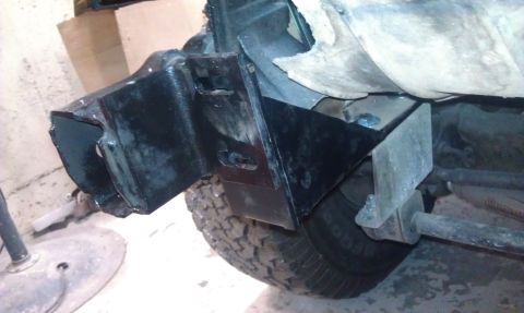 1995 Ford Bronco - Undercarriage view showing frame reinforcement and suspension components.