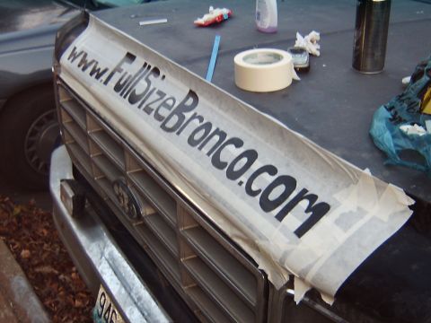 1982 Ford Bronco - Custom lettering being applied to the grille of a 1982 Ford Bronco.