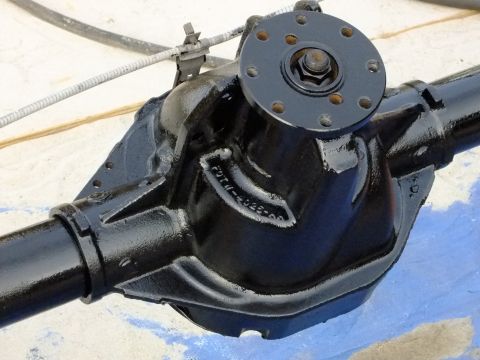 1995 Ford Bronco - A black rear axle differential housing is shown, with a part number stamped on its casing.
