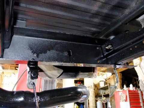 1995 Ford Bronco - Underside view of a vehicle's chassis, showing frame rails and exhaust components.