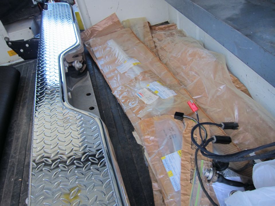Diamond plate trim and wrapped parts in a truck bed
