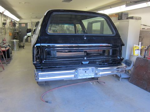 1987 Dodge 1500 - Rear view of a 1987 Dodge 1500 undergoing work in a garage.