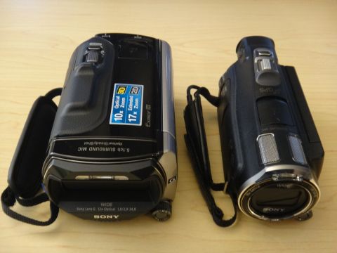 1993 Ford Taurus - Two Sony camcorders are displayed on a wooden desk, showing their lenses and controls.