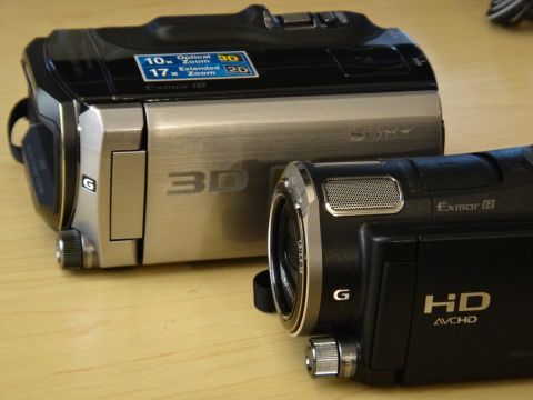 1993 Ford Taurus - Two Sony camcorders are shown, one with 3D capabilities and the other with HD AVCHD technology.
