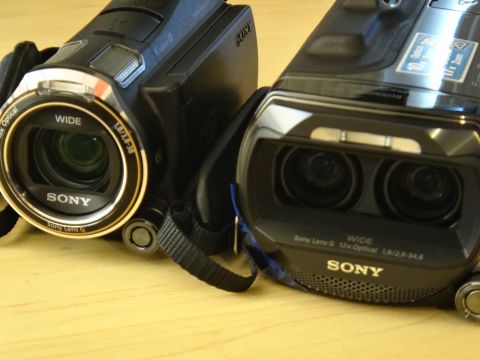 1993 Ford Taurus - Two Sony camcorders are shown on a wooden surface.
