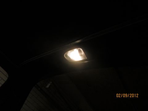 1979 Ford Bronco - The interior dome light is on, illuminating the dark cabin of the vehicle.