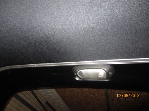 1979 Ford Bronco - Close-up of a vehicle's interior headliner and dome light.