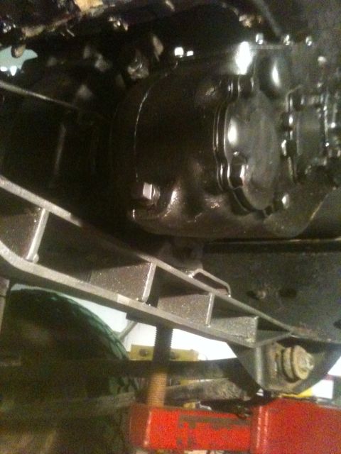 1993 Ford Bronco - Close-up of the vehicle's undercarriage, showing the transmission and frame components.