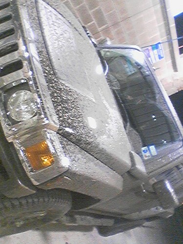 1989 Ford Bronco - Mud covers most of this vehicle's front corner, obscuring details.