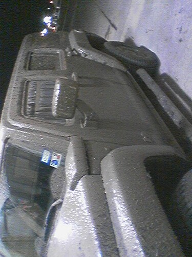 1989 Ford Bronco - This vehicle is heavily covered in mud, obscuring its make and model details.