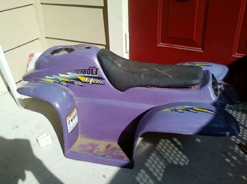 1989 Ford Bronco - Purple ATV body panel with 'THUNDERBOLT' decal and checkered flags is shown.