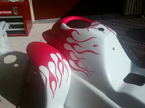1989 Ford Bronco - Motorcycle fairing with custom flame graphics, possibly for a sportbike.