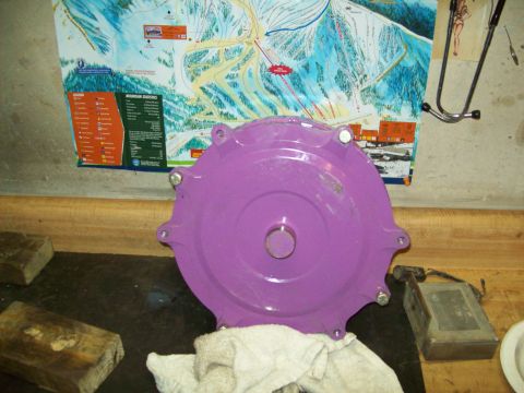 1993 Ford F-150 - A purple transmission part is shown against a wall with a ski map and a stethoscope.