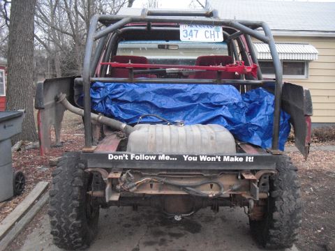 1986 Ford Bronco - This 1986 Ford Bronco has a custom roll cage and a large external fuel tank.
