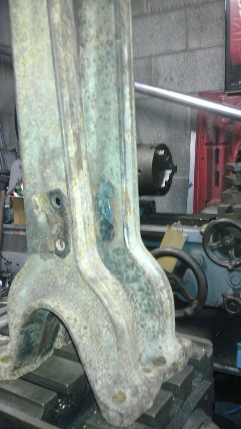 1987 Ford Ranger - This weathered metal part shows signs of age and use, with visible mounting holes and a greenish patina.