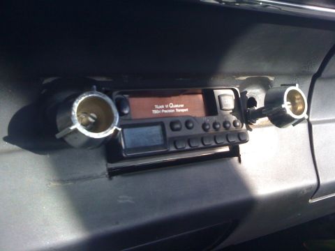 1964 Ford Ranchero - Aftermarket car radio installed in dashboard, with cigarette lighter sockets on either side.