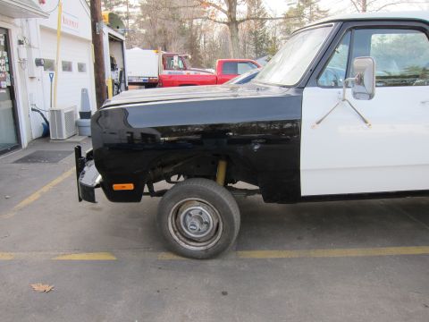 1987 Dodge 1500 - 1987 Dodge Ram pickup truck showing its side profile with a two-tone paint scheme.