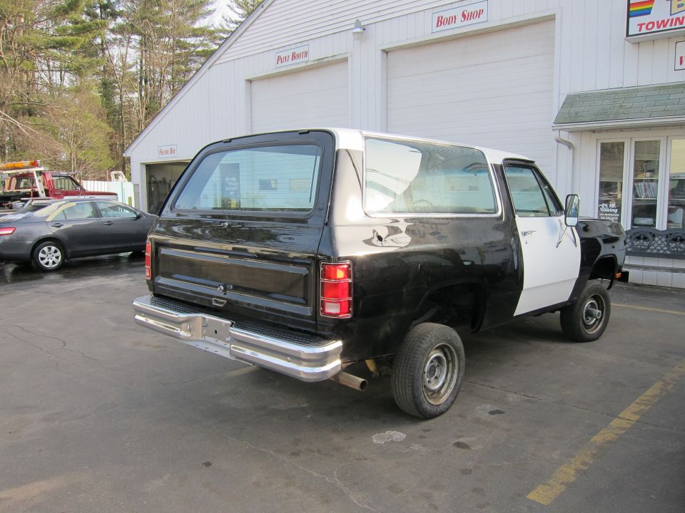 Rear view of a black and white 1987 Dodge Ramcharger SUV