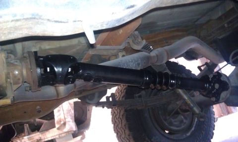 1995 Ford Bronco - Underside view of a 1995 Ford Bronco, showing the driveshaft and exhaust system.