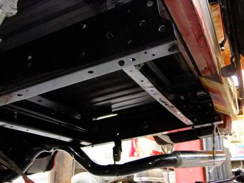 1995 Ford Bronco - The underside of a 1995 Ford Bronco, showing the rear chassis and exhaust system after detailing.