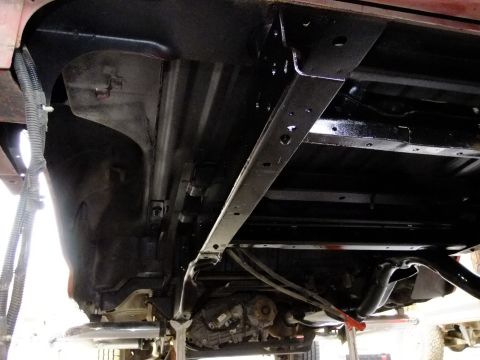 1995 Ford Bronco - Vehicle chassis and drivetrain components viewed from below, showing detailing work.