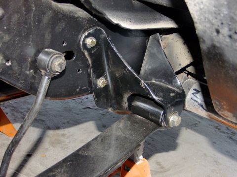 1995 Ford Bronco - Detail of a vehicle's rear chassis suspension component, possibly a bracket or mount.