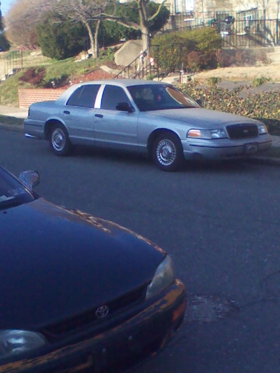Silver 1999 Ford Crown Victoria 3q-front view