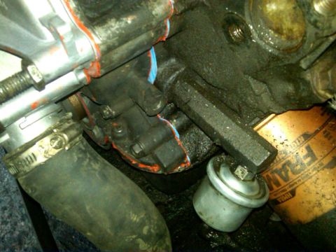 1987 Ford Bronco - The last picture shows a closeup of this section. The silver thingy is the Oil pressure switch, no idea what goes into the threaded open pa…