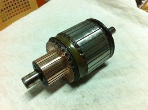 1998 Ford Crown Victoria - A close-up view of a starter motor armature, a key component in an engine's starting system.