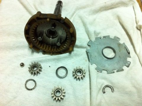 1998 Ford Crown Victoria - The internal components of a starter motor are laid out for repair or inspection.