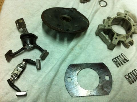 1998 Ford Crown Victoria - Various engine components laid out for inspection or repair on a white cloth.