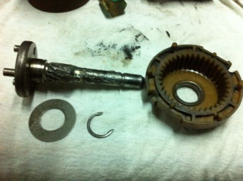 1998 Ford Crown Victoria - Starter motor parts laid out on a cloth for disassembly and repair.