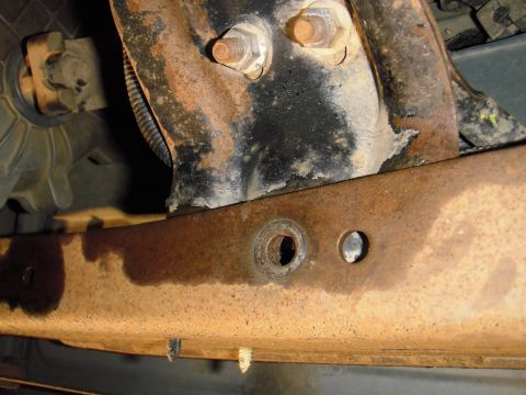1995 Ford Bronco - The best locate, the 2 holes you can see are factory. The foward hole you can see was used for the rear hole in the bracket. I drilled the…