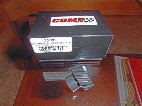 1990 Ford Bronco - A Comp Cams distributor gear is shown with its packaging and a barcode.