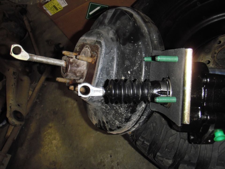 Brake booster and master cylinder assembly with pushrod and mounting bolts