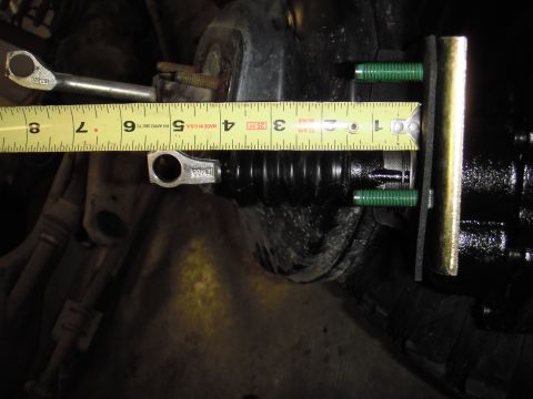 1995 Ford Bronco - A tape measure is used to measure the clutch master cylinder, showing its dimensions.